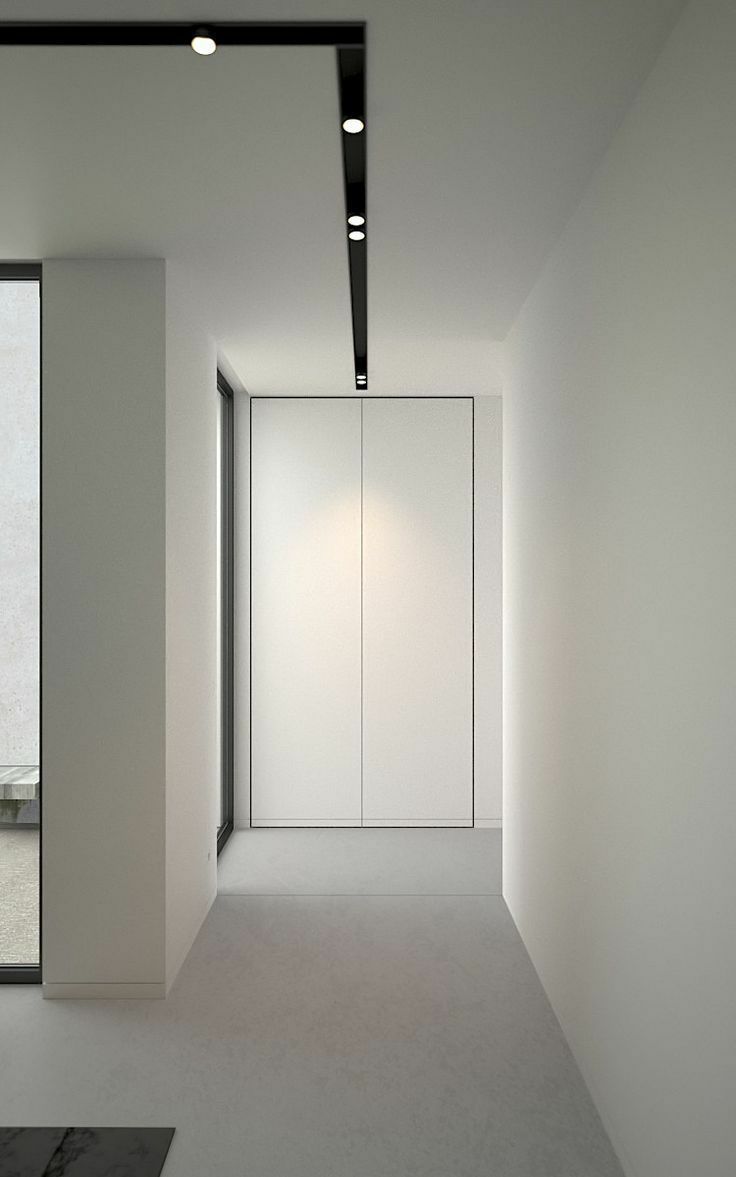 顶天立地的嵌入式柜子,因为没有把手,会在视觉上给人一种融于墙面的